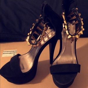 Black suede stilleto heels.